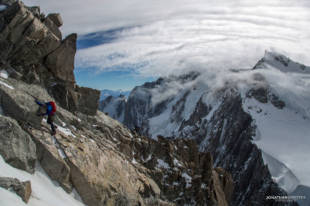 Topping out from the arete and on to the final slopes to the summit