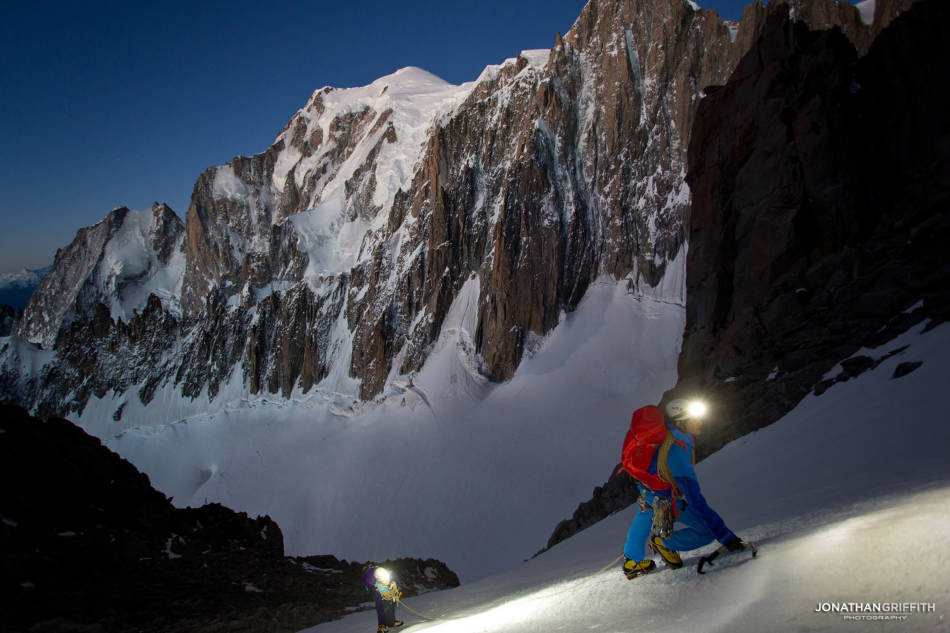 Ben and Sandra under a half moon with Mont Blanc behind