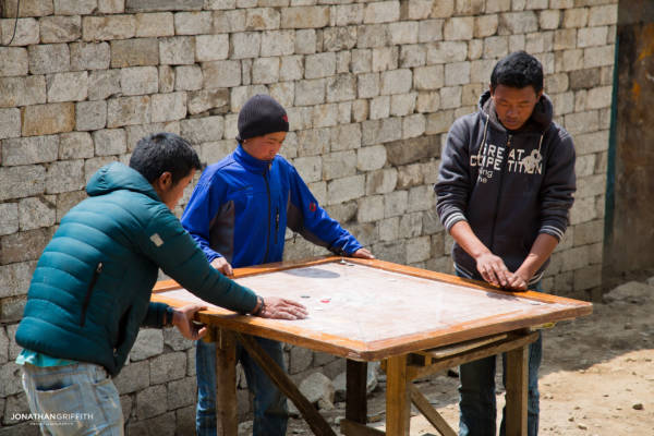 Kids play a board game in Namche Bazar