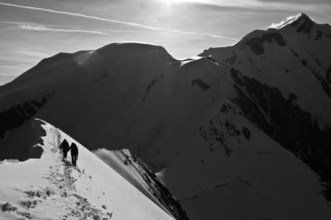 Two climbers on the Bionassay ridge, Mont Blanc in the background