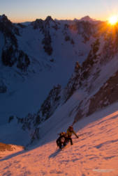 Two skiers on the Couturier at sunrise