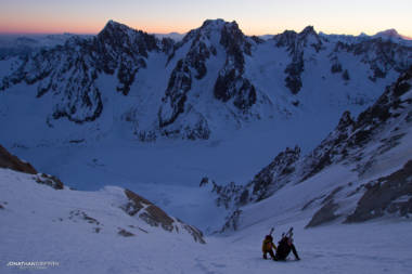 Two skiers on the Couturier at day break