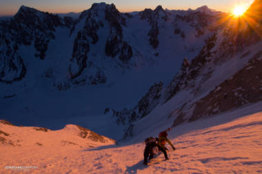 Two skiers on the Couturier at sunrise