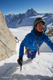 Max questing out of the sun and in to the cold couloir with the Grandes Jorasses in the backgorund