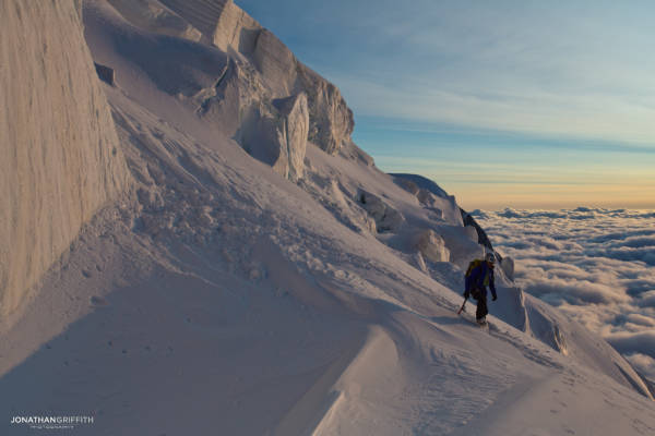 Tom heads off the Tacul N Face at sunset