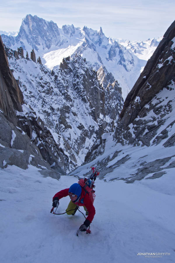 High up in the couloir with the Grandes Jorasses North Face in the background
