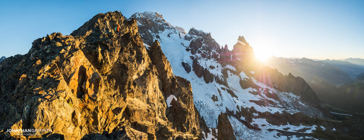 Ally takes in the sunrise over the Peuterey Integral from the Aiguilles Rouges du Brouillard