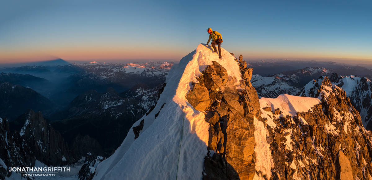 Sunset high up on the Brouillard Ridge to the summit of Mont Blanc. On the left the immense shadows of Mont Blanc itself, our end point, stretches far out in to Italy.