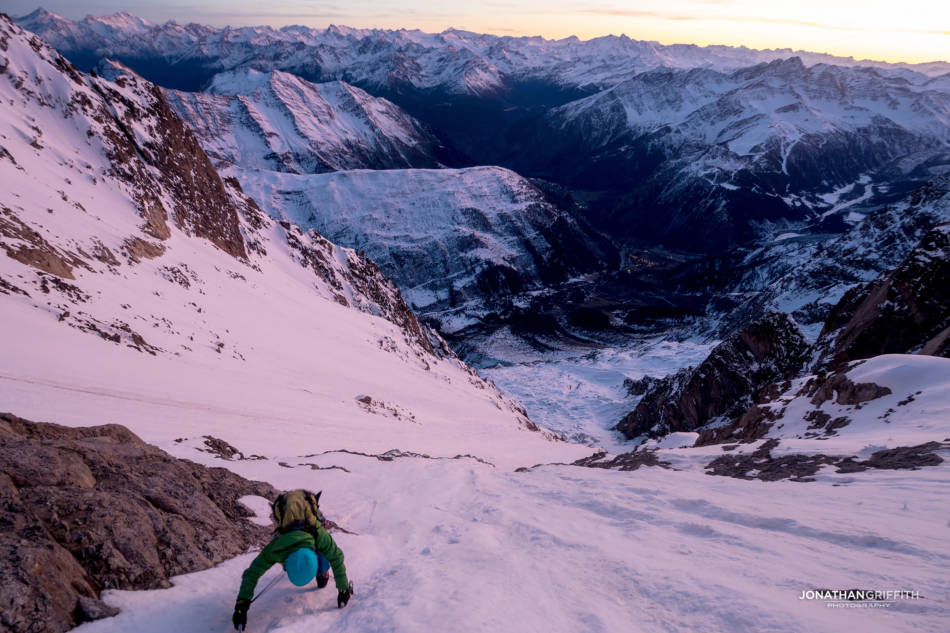 Descending down at sunset, Courmayeur lights far below