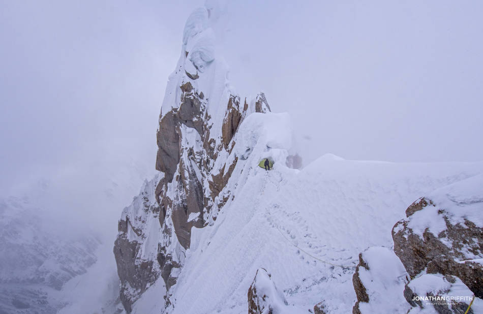 Bad weather is one of the best times to shoot for pure dramatic shots- wall to wall sunshine has nothing on big mountain storms. Get that camera out- it's tougher than you are and will be fine in the snow
