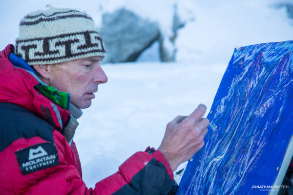 First ascentionist Andy Parkin draws the route at the base